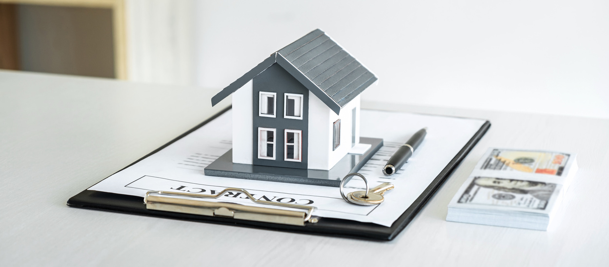 House Model and Money, House Key Lying on Real Estate Contract,